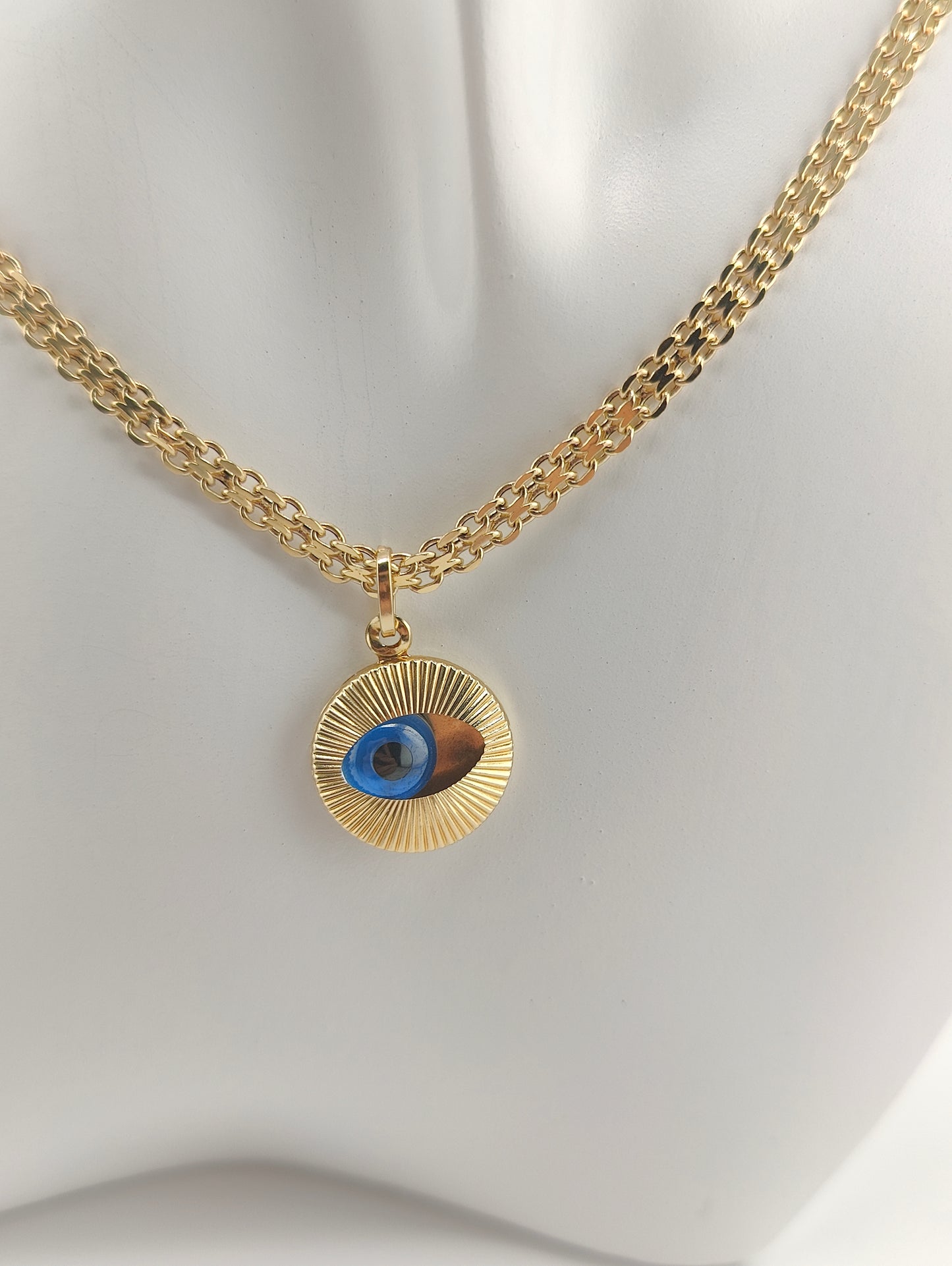 Golden eye pendant