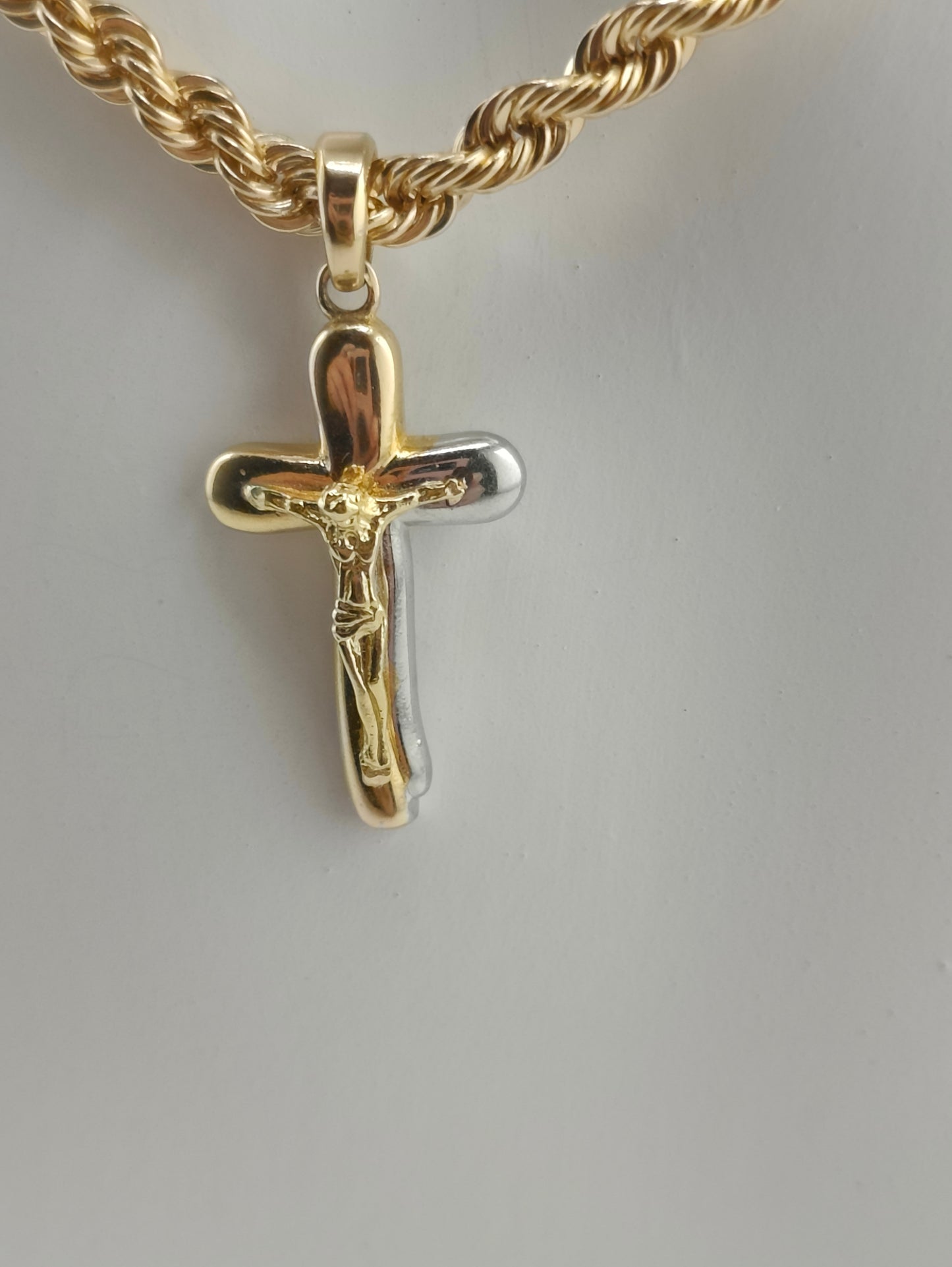 Golden and silver cross pendant
