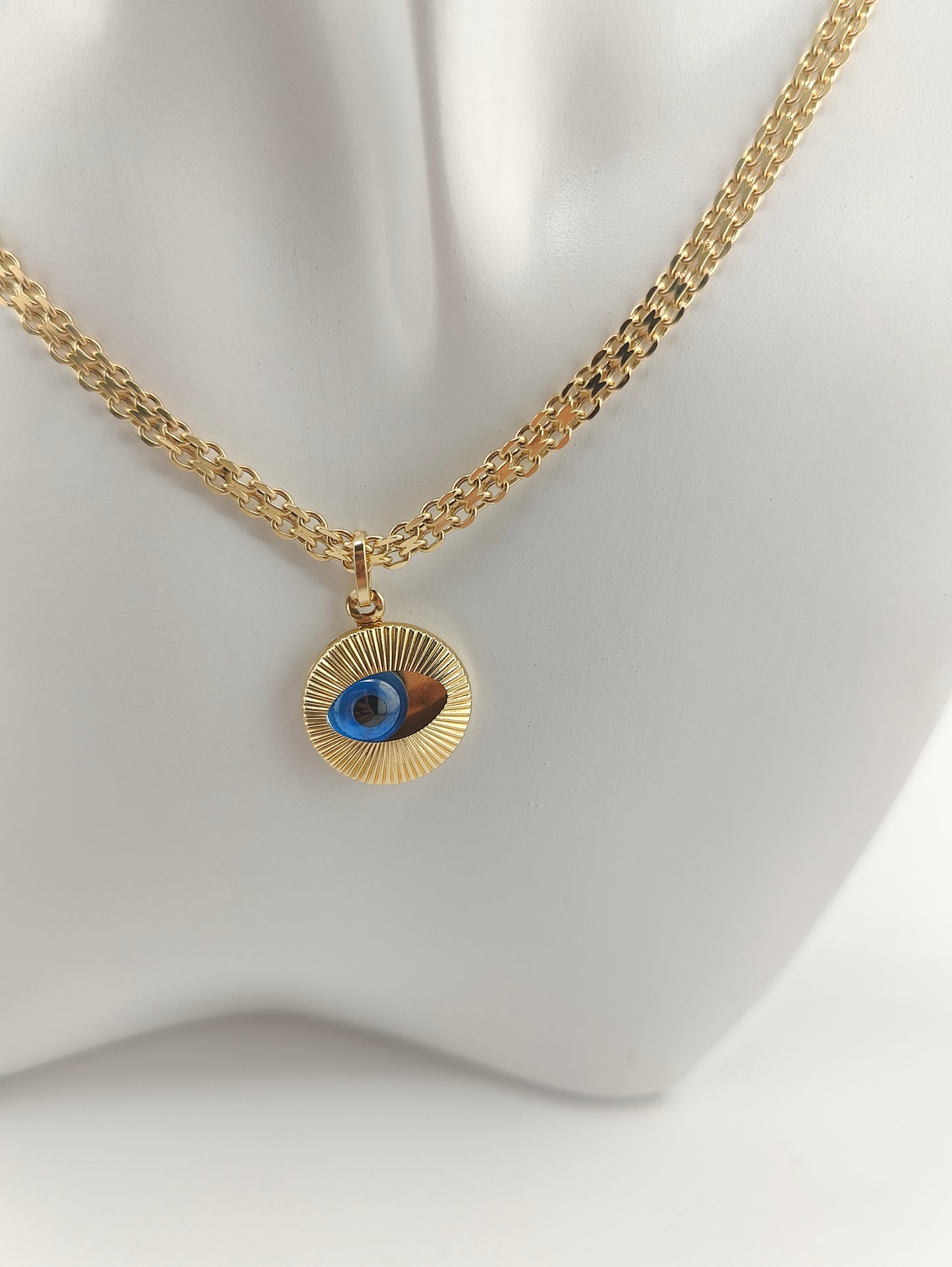Golden eye pendant
