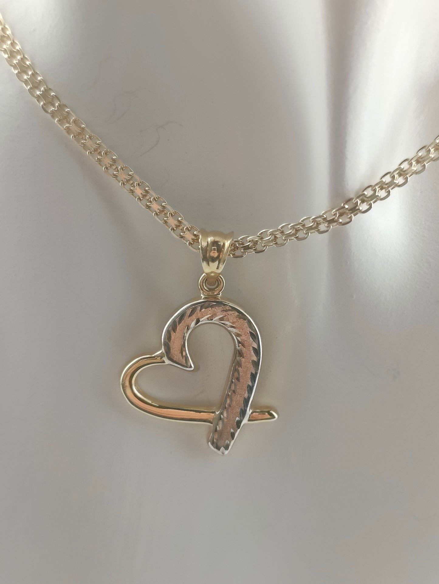 Golden hollow heart pendant